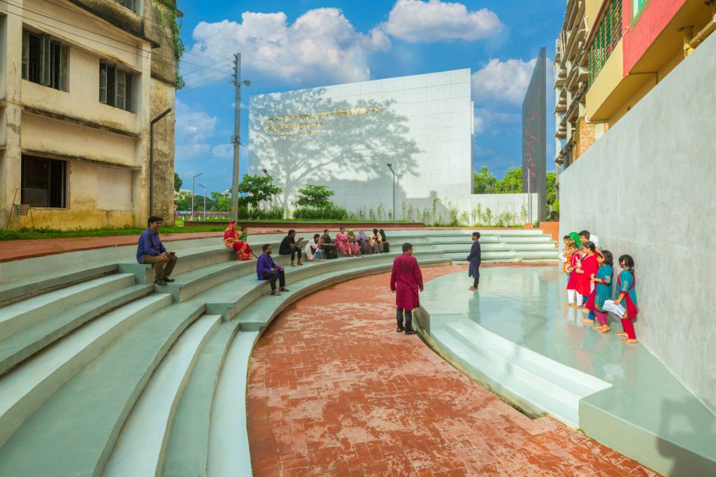 "Visitors admiring the Monument to Memory and its cultural significance."
