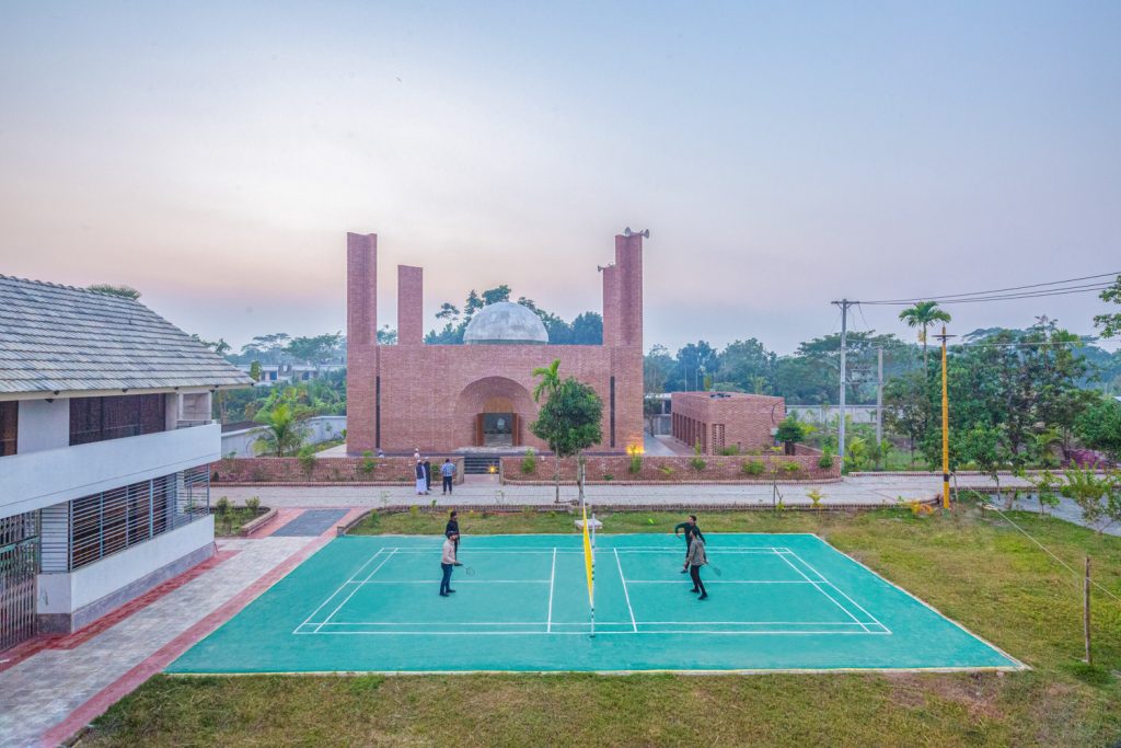 "Warm brick textures illuminated by soft natural light"